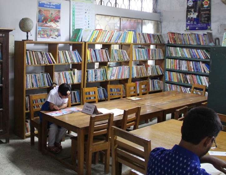 Image of student in a library