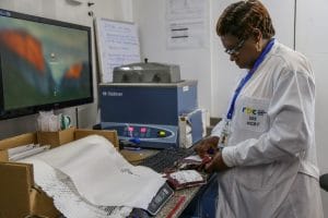 Rwandan doctor reviewing test results